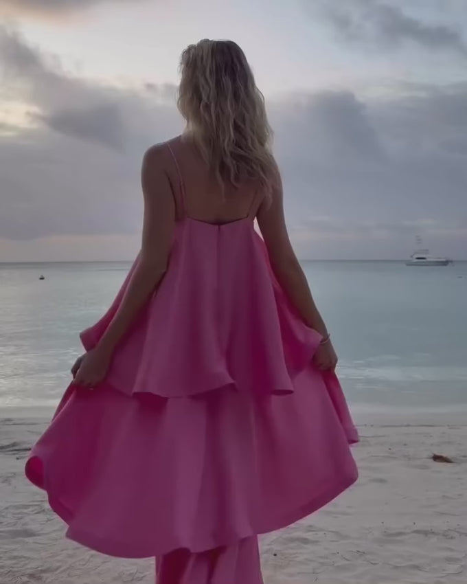 The Tilly Tiered Maxi Dress in Pale Pink is a graceful choice for bridesmaids, weddings, or special celebrations. Its flowing tiered skirt creates gentle layers that move beautifully with every step, adding a romantic and feminine touch. Made from lightweight textured satin, this gown offers a subtle sheen while remaining comfortable for all-day wear. Thin adjustable straps allow for a perfect fit, giving support and flexibility for long events. 